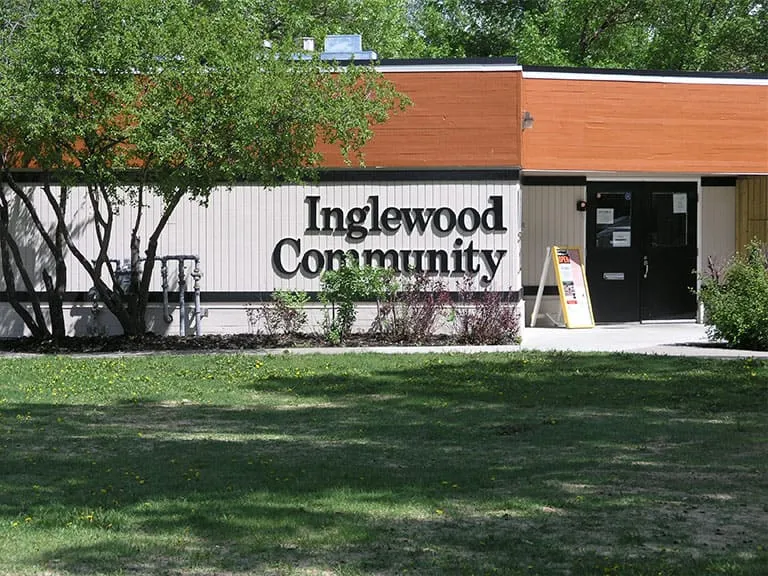 The Inglewood Community hall sign on a lawn beside the building